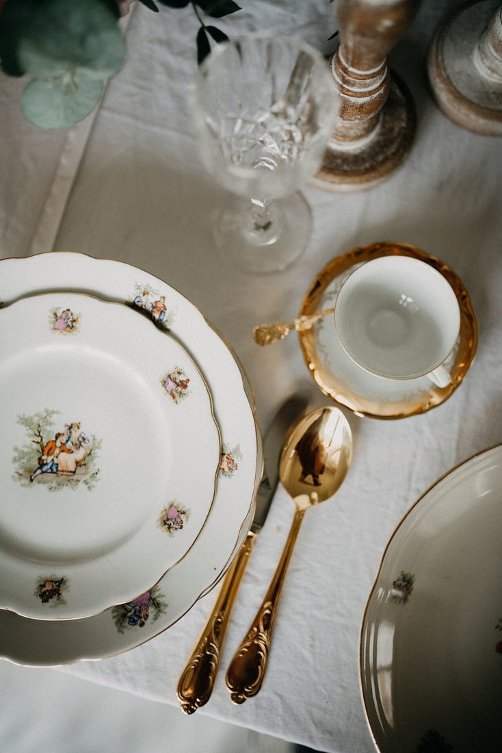 Floral china dinner set with gold cutlery